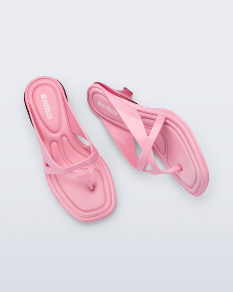 Top and side view of a pair of pink Layla kitten heel flip flops