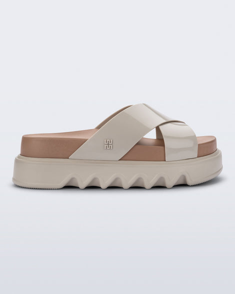 Side view of a beige/brown Cozy Cross platform sandal with crisscross top straps