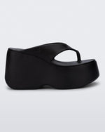Side view of a black Free Thong  Wedge Platform heel
