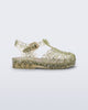 Side view of a yellow Possession Elements baby sandal with glitter hearts