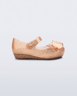 Side view of beige glitter Ultragirl Butterfly baby flats with butterflies on top