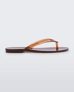 Side view of a clear brown Harmonic Jelly flip flop