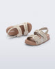 Top and angled view of a pair of beige Cozy M Lover baby sandals