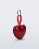 Angled view of a red Heart bag charm