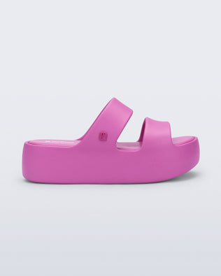 Side view of a pink Free Line Platform slide
