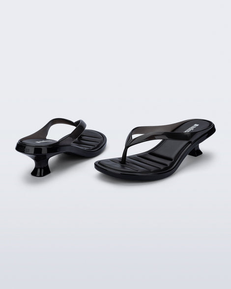 Back and angled view of a pair of black Flip Flop Kitten Heels