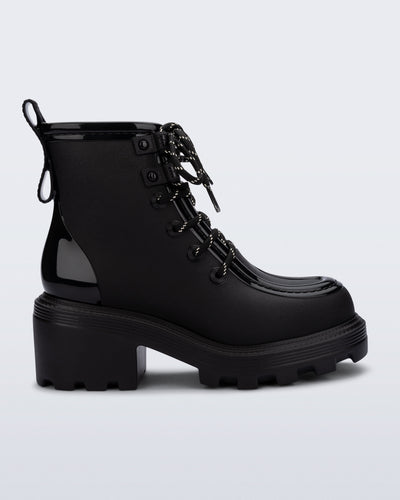 Side view of a black Track Boot with small heel and black laces