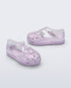 Side and angled view of a pair of pearly lilac Starry baby sandals