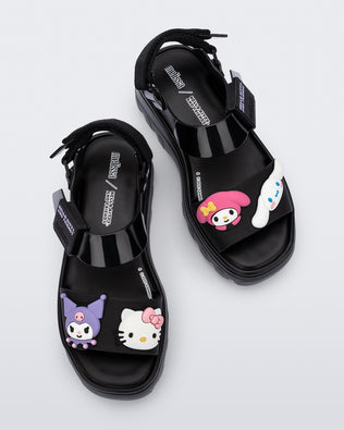 Top view of a pair of black Kick Off Sandals + Hello Kitty and Friends with Hello Kitty and Friends on the upper strap