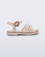 Side view of a beige Aurora baby sandal with brown trim and buckle