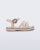 Side view of a beige Aurora baby sandal with brown trim and buckle