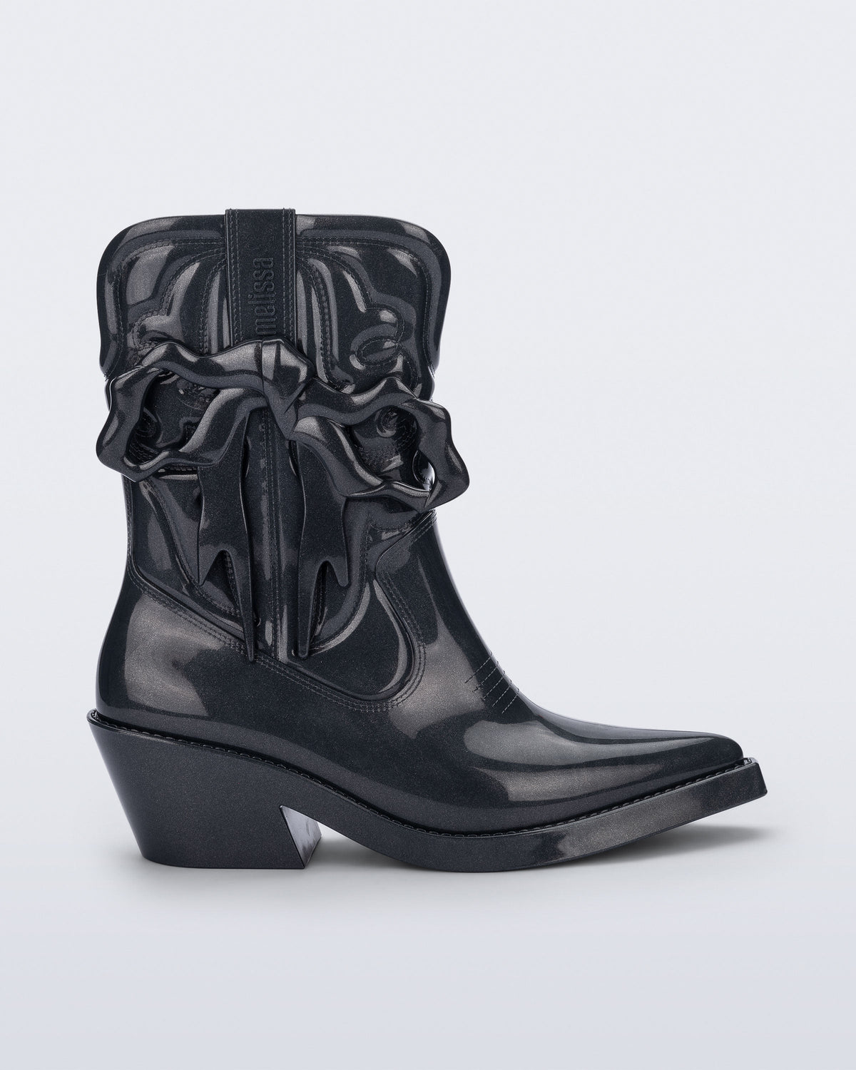 Side view of a metallic grey Texas + Maldito boot