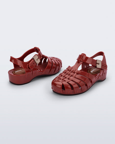Back and angled view of a pair of red Possession Pescura + Scholl fisherman sandals