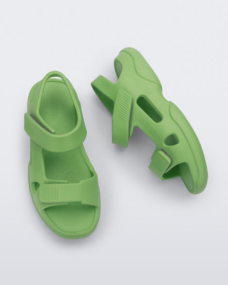 Top and side view of a pair of green Free Papete sandals