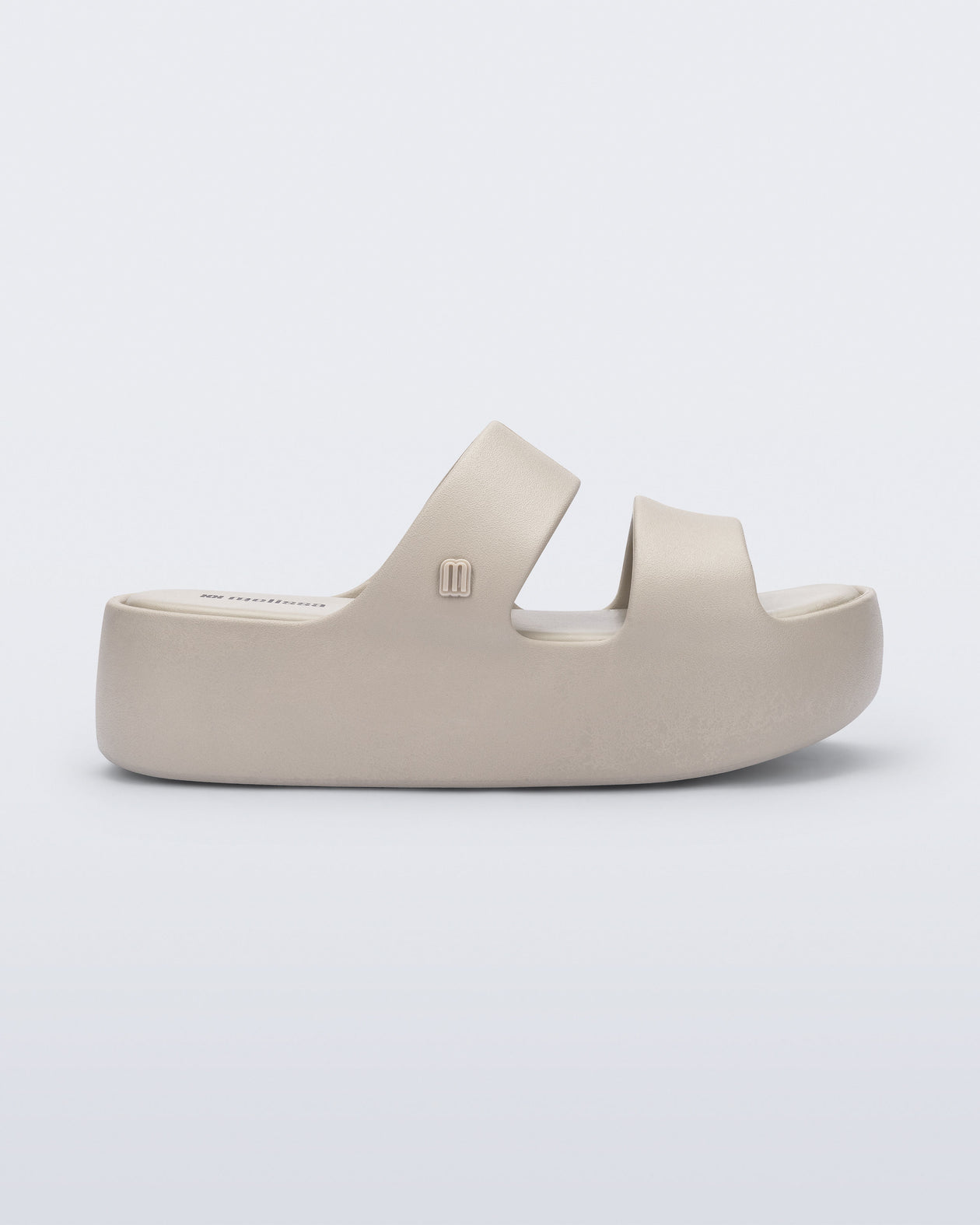 Side view of a beige Free Line Platform slide