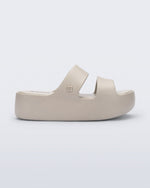 Side view of a beige Free Line Platform slide