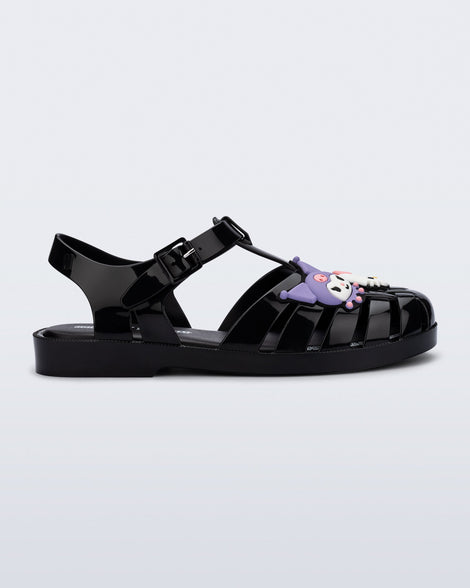 Side view of a black Possession + Hello Kitty and Friends fisherman sandal with Hello Kitty and friends on the upper