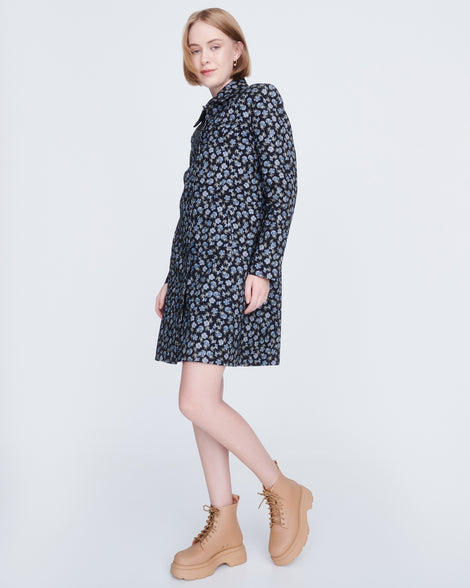 Model short blue patterned rain coat wearing a pair of matte beige Coturno Soft Platform boots