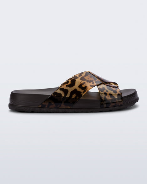 Side view of a dark brown/tortoise Cozy Cross sandal with crisscross top straps