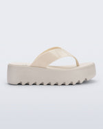 Side view of a beige Thong Platform flip flop
