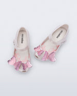 Top view of a pair of pearly white Ultragirl Butterfly baby flats with pink butterflies on top