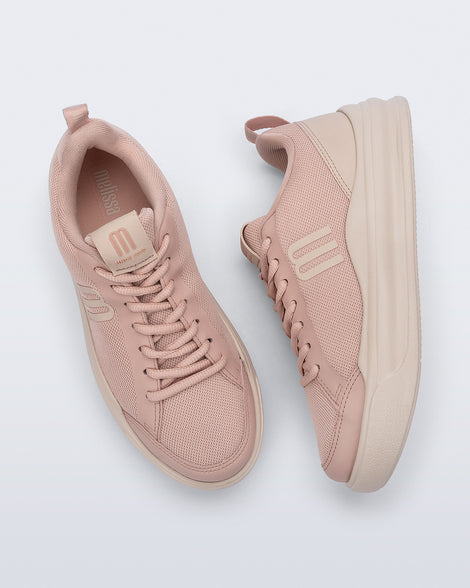 Top and side view of a pair of pink X Mood sneakers