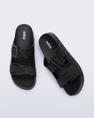 Top view of a pair of black Cozy Connection slides