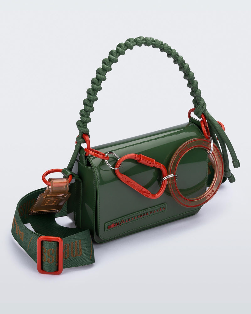 Angled view of an dark green Olga Bag + Alexandre Pavao with short strap fabric long  strap