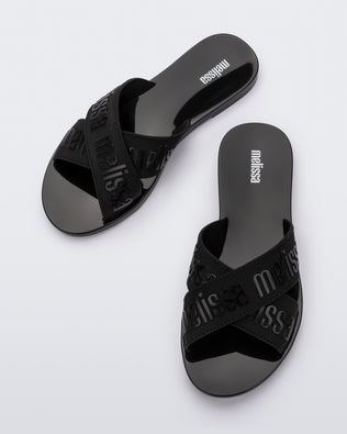 Top view of a pair of black M Lover adult slides
