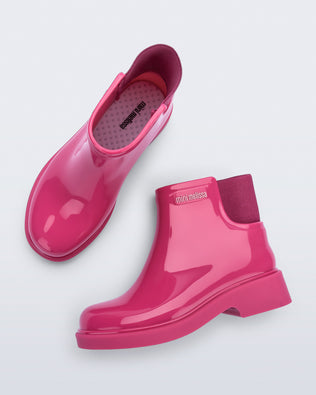 Top and side view of a pair of pink Chelsea II kids boots