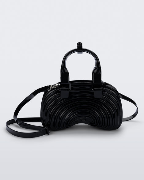 Back view of a black Quantum Dome + Diesel bag with hand strap and shoulder strap