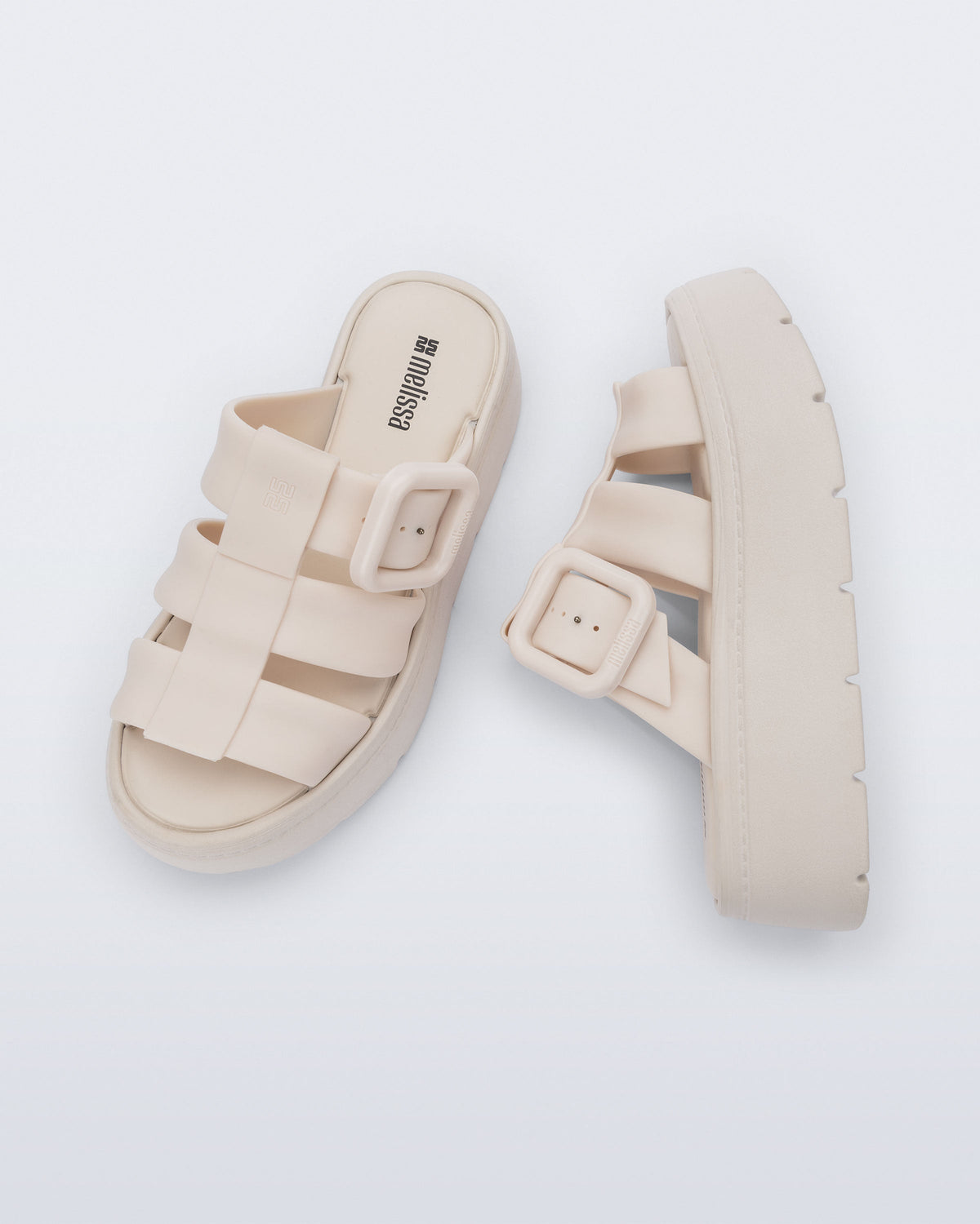 Top and side view of a pair of beige Pump Platform sandals