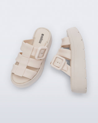 Top and side view of a pair of beige Pump Platform sandals