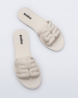 Top view of a pair of beige M Slide sandals