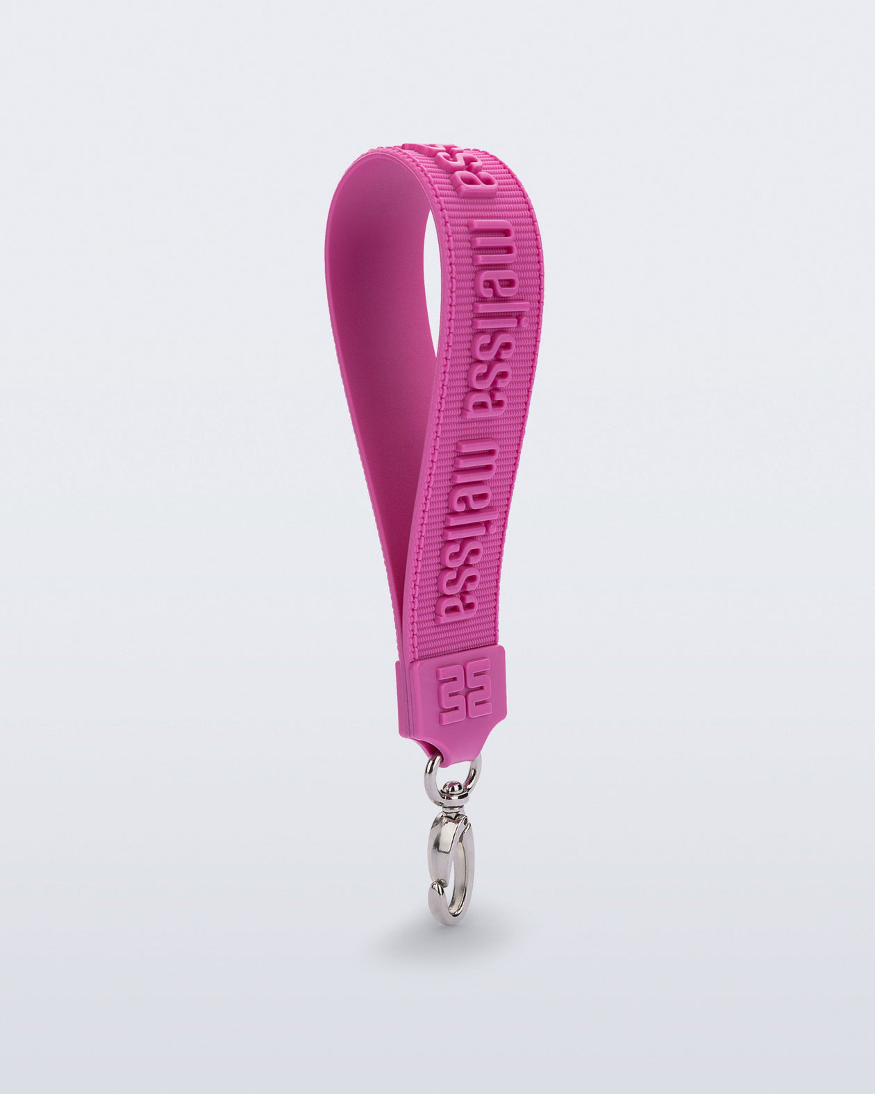 Angled view of a pink M Lover Charm with the Melissa logo