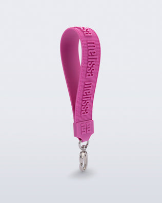Angled view of a pink M Lover Charm with the Melissa logo