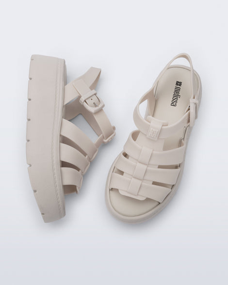 Top and side view of a pair of light beige Up Platform sandals
