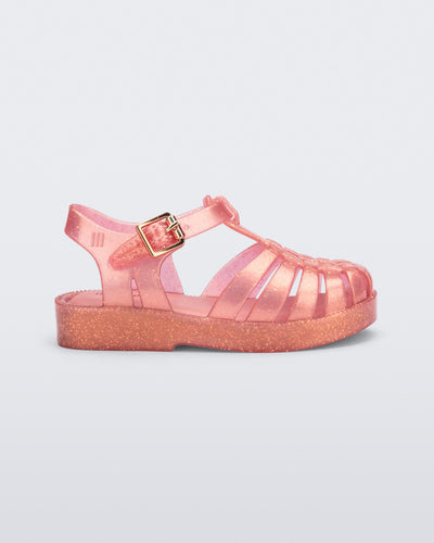 Side view of a pearly pink Possession sandal