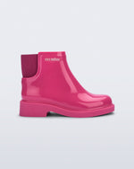 Side view of a pink Chelsea II kids boot