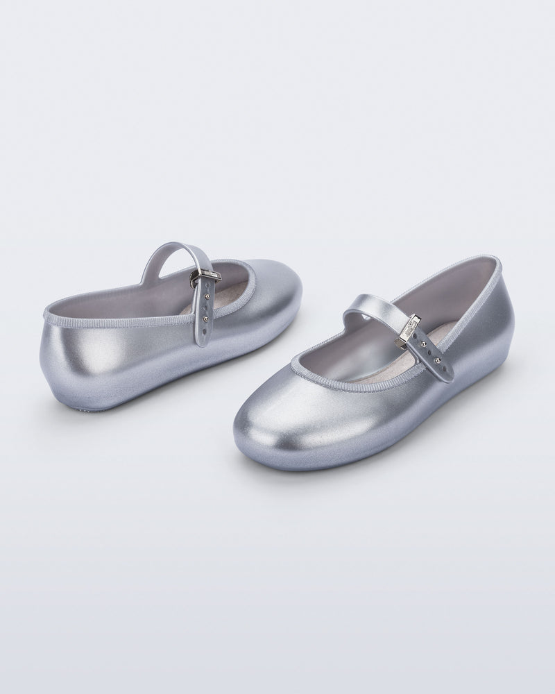 Side and top angled view of a pair of silver Soft Ballerina kids flats