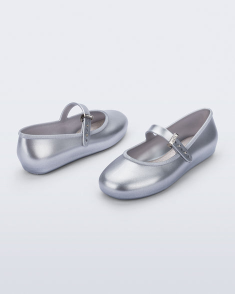 Side and top angled view of a pair of silver Soft Ballerina kids flats
