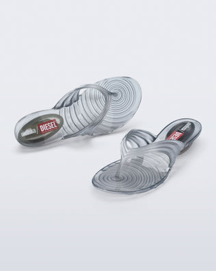 Top and angled view of a pair of silver Quantum Flip Flips