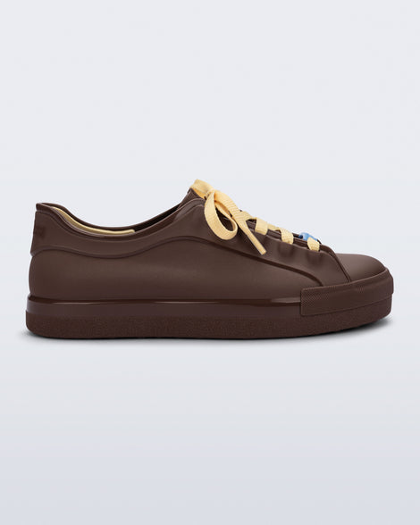 Side view of a brown Wow Sneaker with beige shoe laces