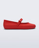 Side view of a red Soft Ballerina flat with top buckle strap
