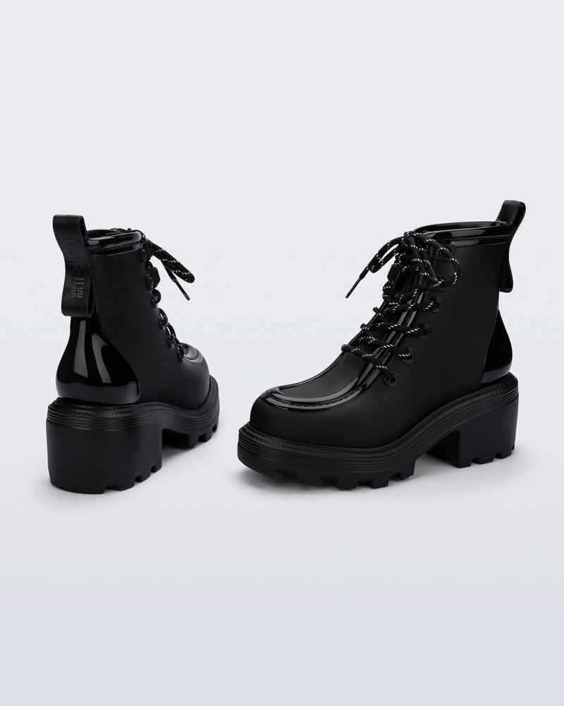 Back and angled view of a pair of black Track Boot with small heel and black laces