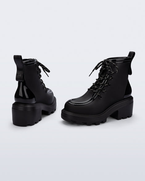 Back and angled view of a pair of black Track Boot with small heel and black laces