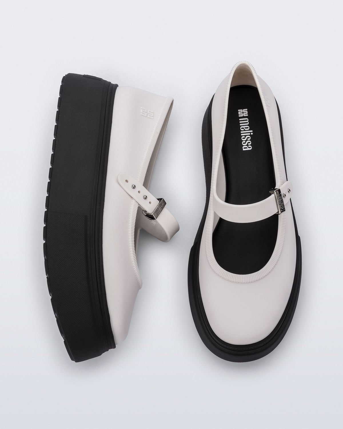 top and side view of a pair of white Soft Ballerina Platform flats with black soles