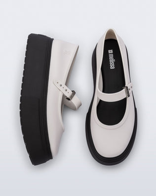 top and side view of a pair of white Soft Ballerina Platform flats with black soles