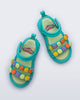 Top view of a pair of blue Create + Play Doh sandals with multicolored dots on the straps