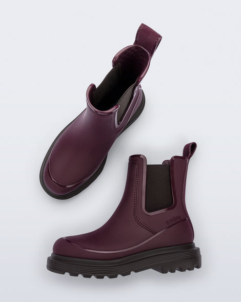 Top and side view of a pair of burgundy Noir Boots with brown soles